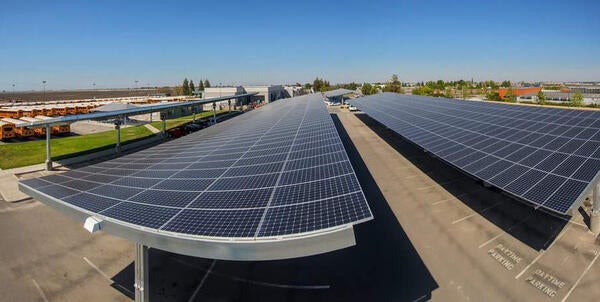High vantage point view of solar panels on top of shelter structures in parking lot number 30 at UCR.