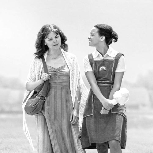 Two young women walking. Image features a film called 'I Am Somebody’s Child: The Regina Louise Story'